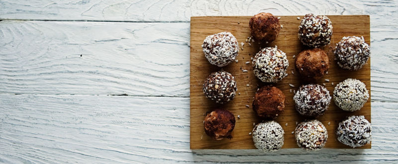 Healthy energy balls with cocoa, sesame and coconut