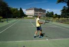 Playing tennis outdoors at Kirtlington Park